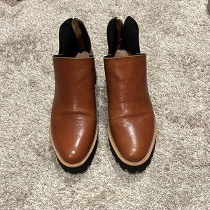 All Black ankle boots/shoes. Chestnut color black rubber sole, zip back . Sz 7